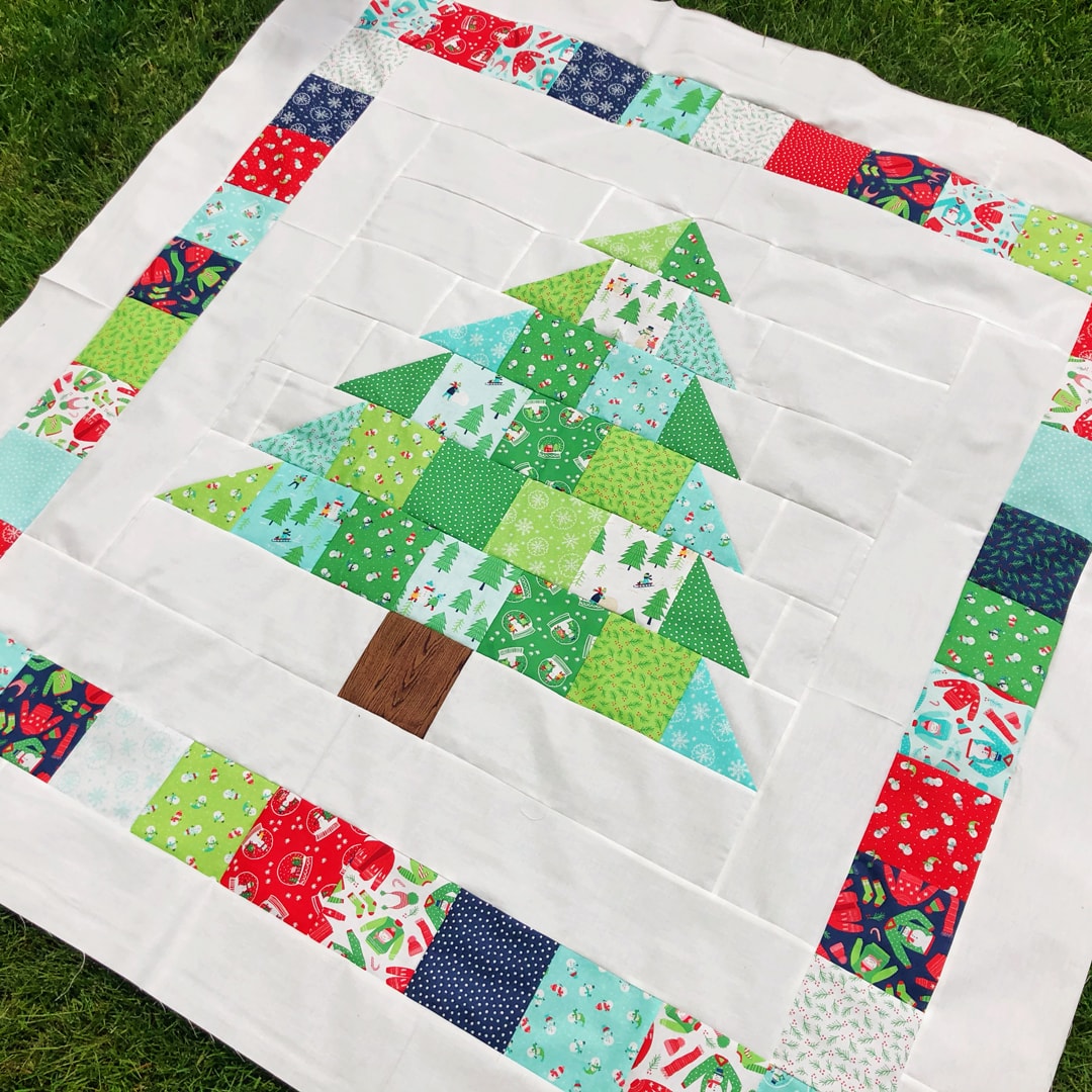 https://blog.fatquartershop.com/shortcut-quilt-charming-christmas-free-charm-pack-pattern/jessica/