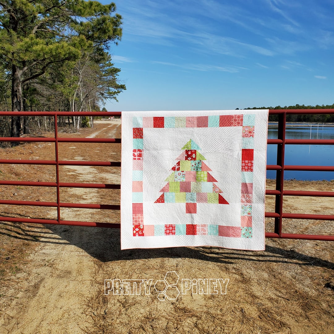 https://blog.fatquartershop.com/shortcut-quilt-charming-christmas-free-charm-pack-pattern/pretty-piney-quilts-charming-christmas/