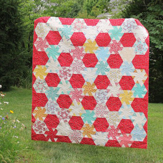 http://bryanhousequilts.com/2016/07/little-ruby-quilt-along-finish.html