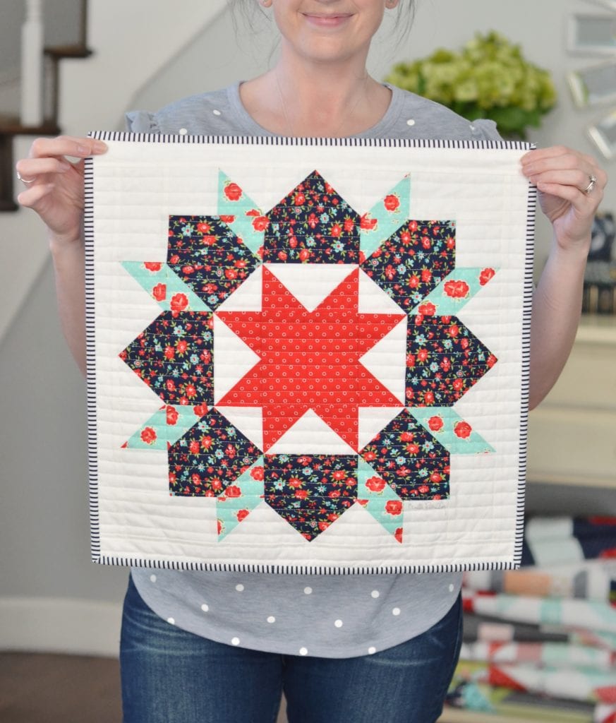 Camille with the autographed Swoon Sixteen Mini Quilt