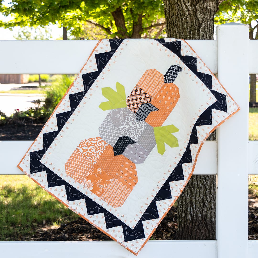 here-is-a-look-at-the-finished-pumpkin-trio-quilt-all-quilted-up