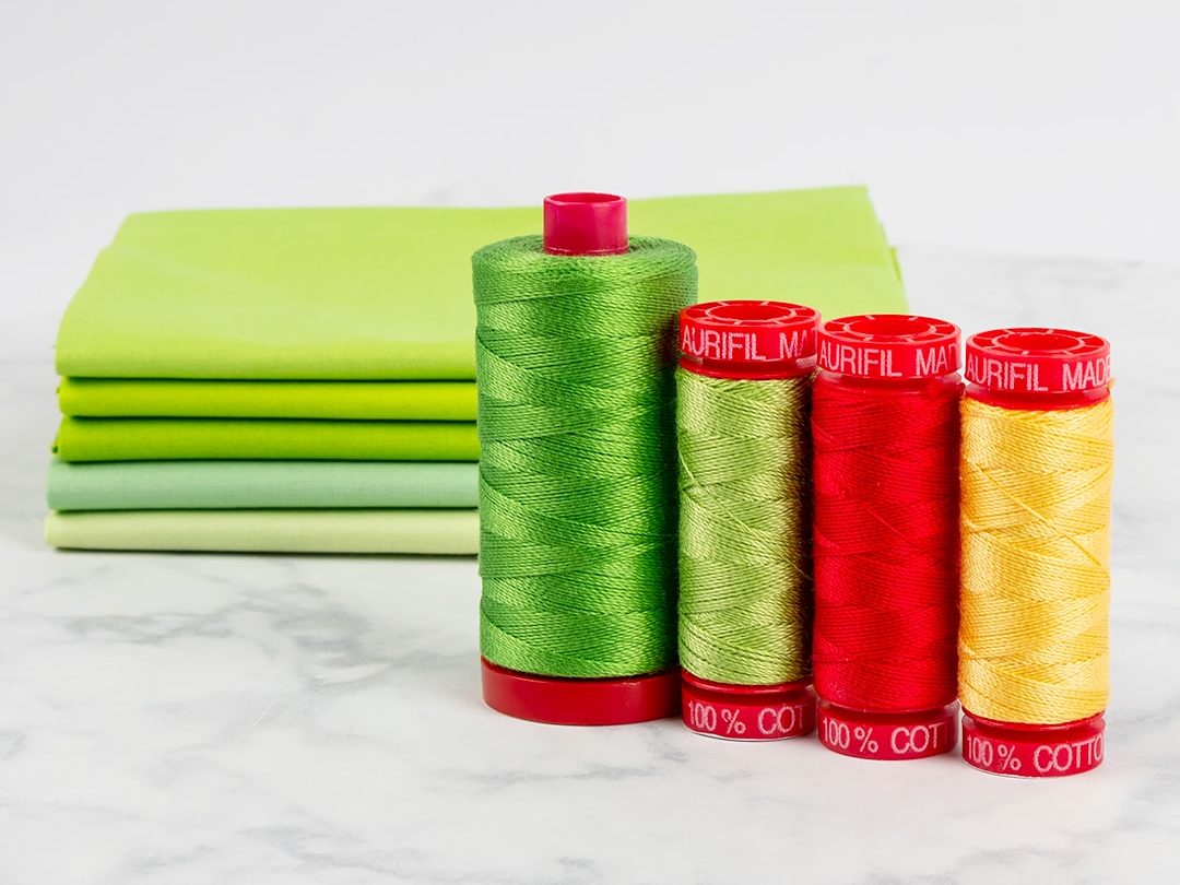 Selection of 12 weight Aurifil threads for quilting 