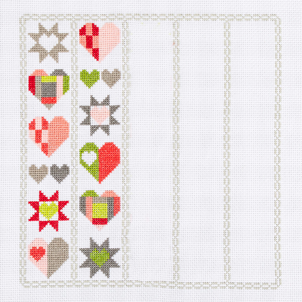 Image of cross stitch with one row of heartfelt charity fundraiser design done. The one row is the Release 3 design. 