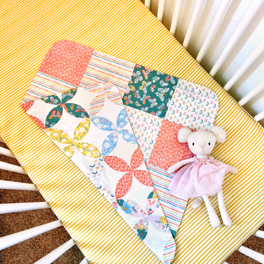 Blossom and Grow fabric featured by it's use in remaking our Two by Two Receiving Blanket