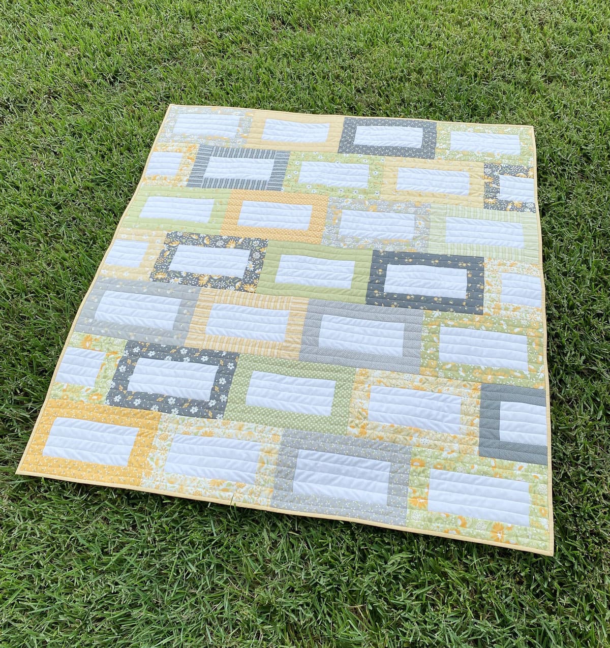 Amanda Wilbert of Pieced just Sew made the Jelly Belly Bars Quilt with Buttercup and Slate by Corey Yoder for Moda Fabrics