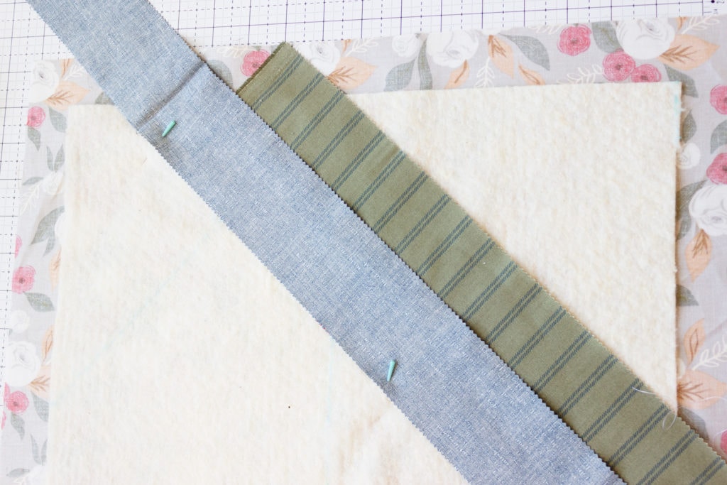 Sew a quarter-inch seam, then press the top fabric piece open. Now you ...