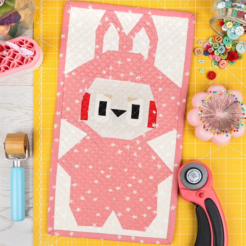 Bunny Monster Quilt Block that looks like a Pink Labubu